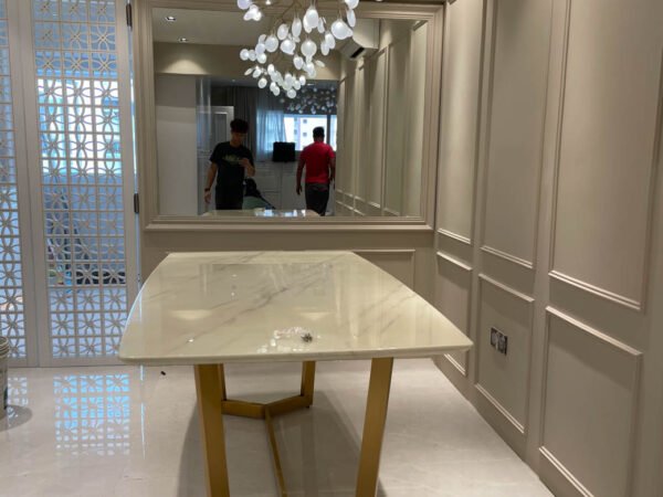 dining room with marble white table and hanging lights
